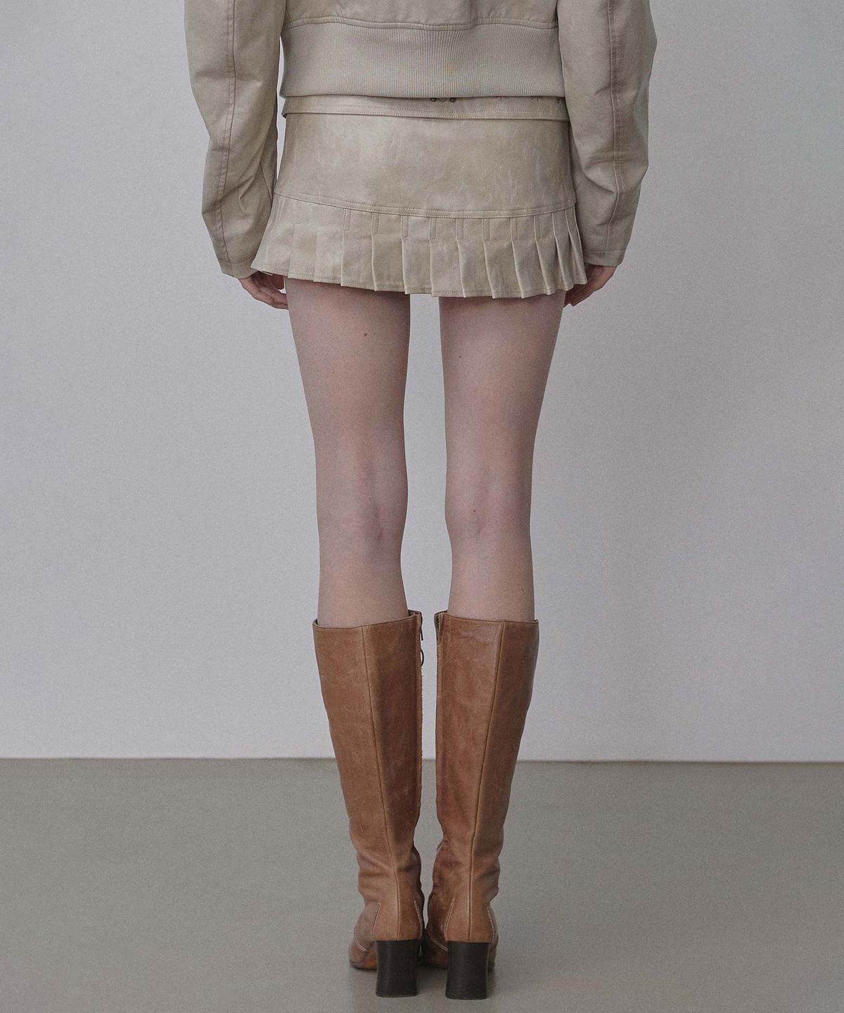 스컬프터(SCULPTOR) Western Faux Leather Micro Skirt Ivory