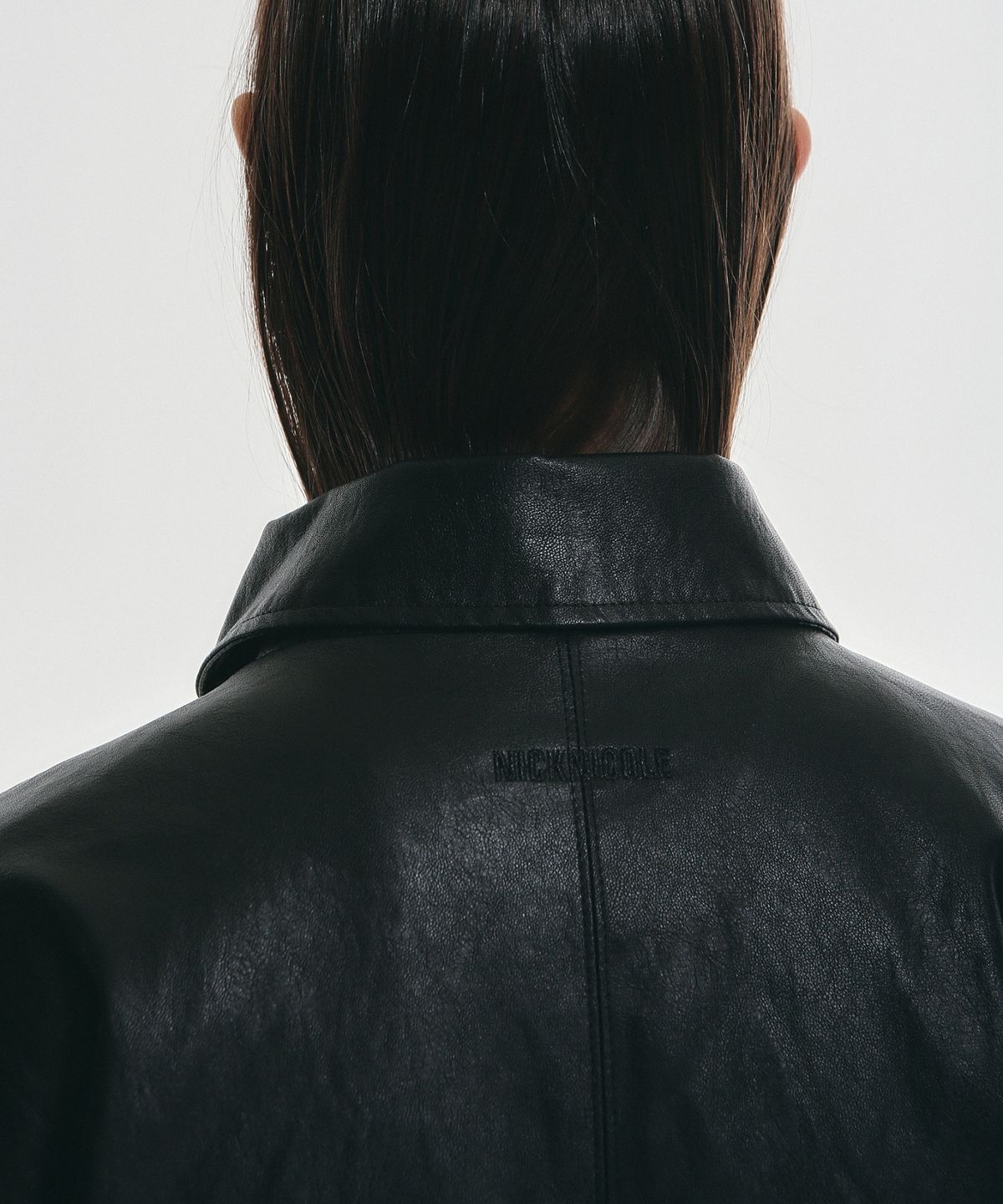 닉앤니콜(NICK&NICOLE) HIDDEN BUTTON MIDI LEATHER JACKET_BLACK