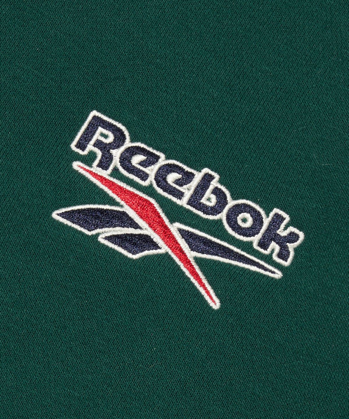 리복(REEBOK) 레터링 기모 하프 집업 - 그린
