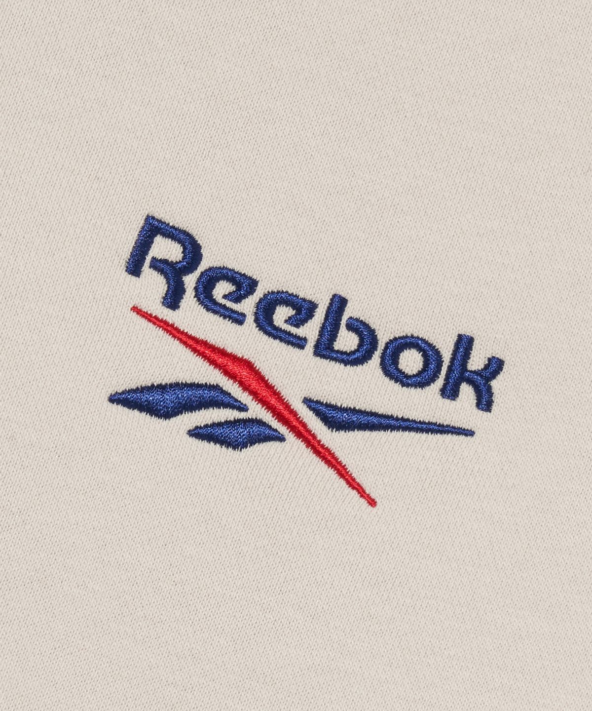 리복(REEBOK) 레터링 기모 맨투맨 - 베이지