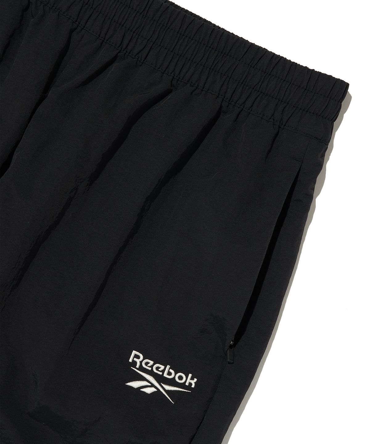 리복(REEBOK) 에센셜 웜업 팬츠 - 블랙