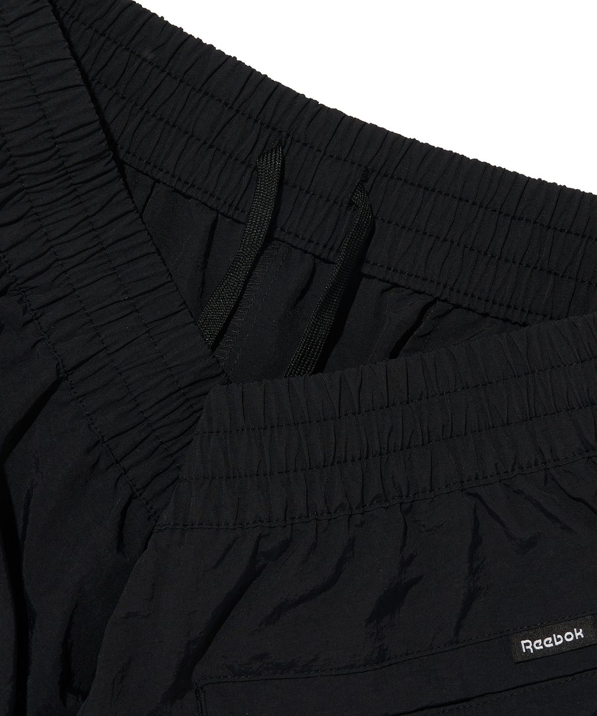 리복(REEBOK) 에센셜 웜업 팬츠 - 블랙