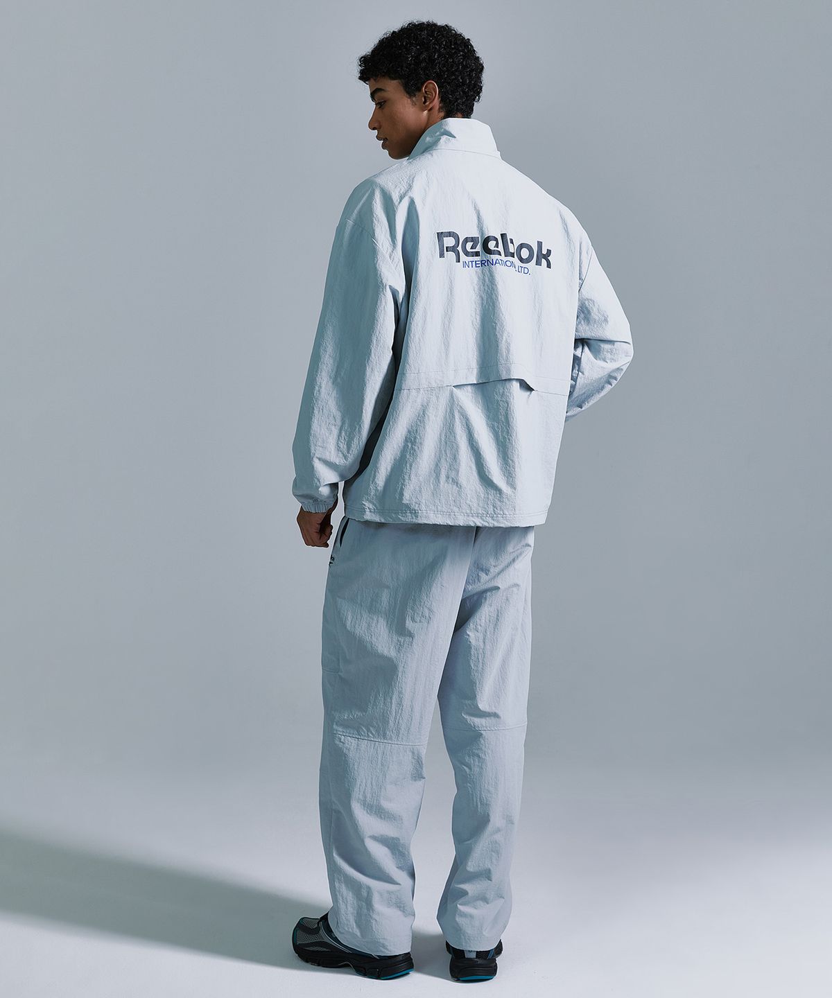 리복(REEBOK) 에센셜 웜업 팬츠 - 그레이