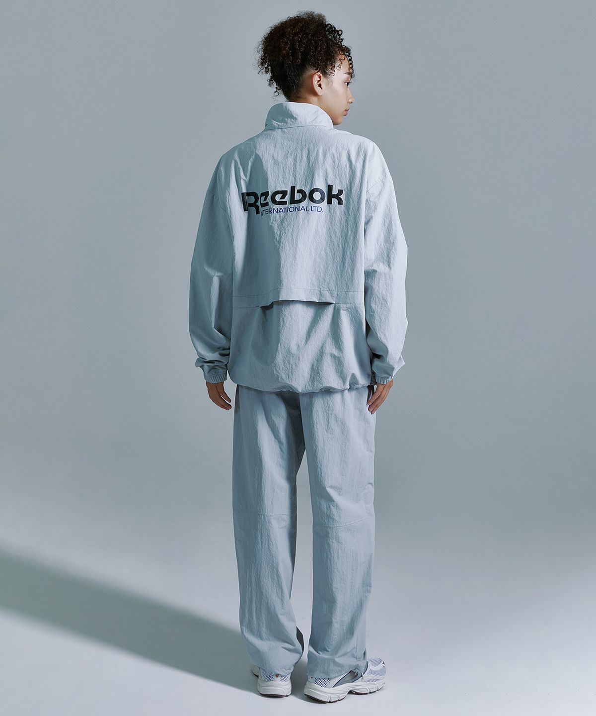 리복(REEBOK) 에센셜 웜업 팬츠 - 그레이
