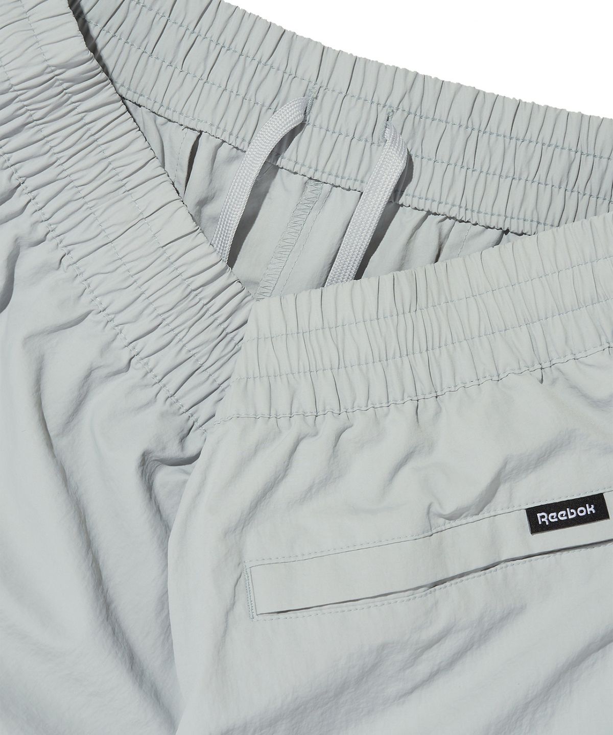 리복(REEBOK) 에센셜 웜업 팬츠 - 그레이