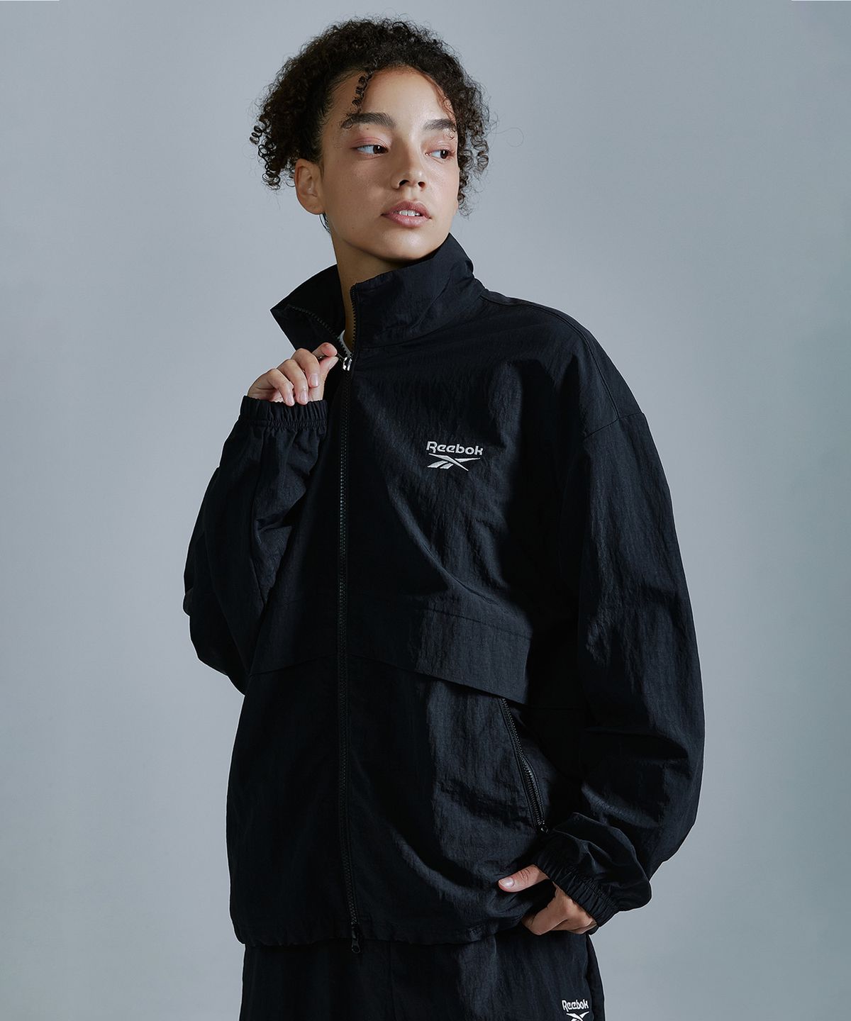 리복(REEBOK) 에센셜 윈드 브레이커 - 블랙