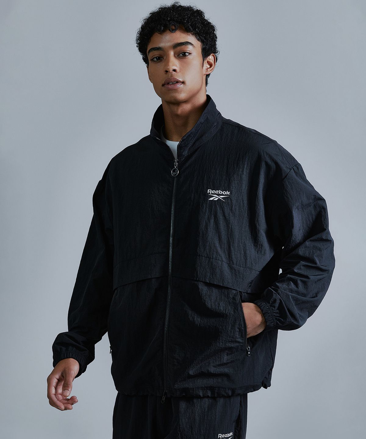 리복(REEBOK) 에센셜 윈드 브레이커 - 블랙