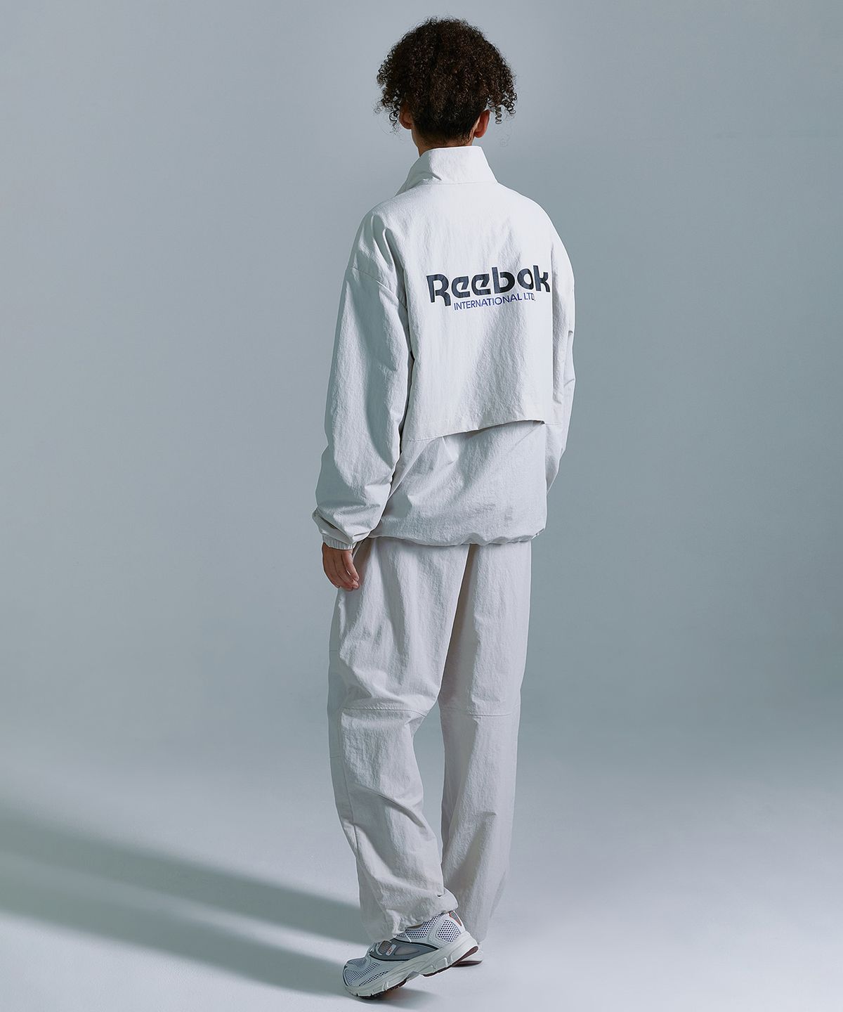 리복(REEBOK) 에센셜 윈드 브레이커 - 베이지