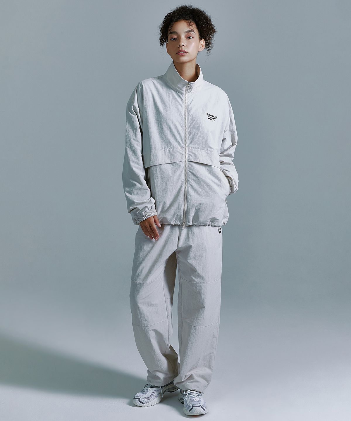 리복(REEBOK) 에센셜 윈드 브레이커 - 베이지