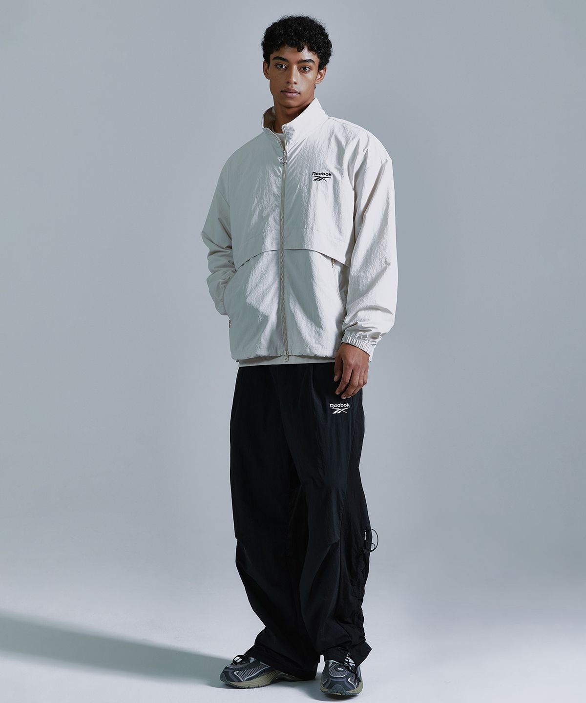 리복(REEBOK) 에센셜 윈드 브레이커 - 베이지