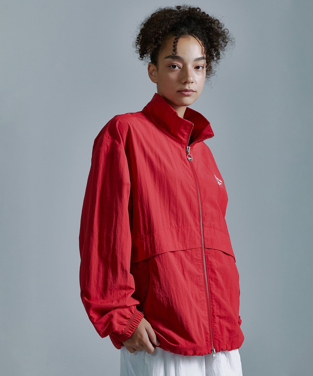 리복(REEBOK) 에센셜 윈드 브레이커 - 레드
