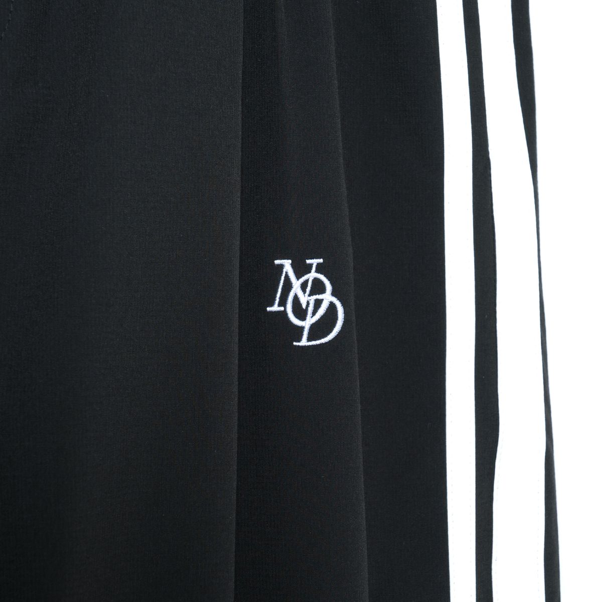 노드(NOD) Side line Wide Nylon pants (Black)