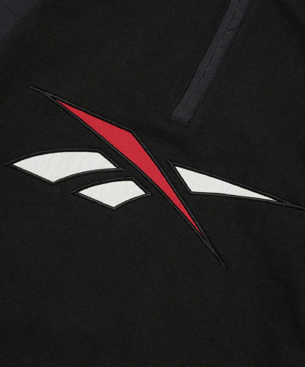 리복(REEBOK) 뉴벡터 하이브리드 하프 집업 - 블랙