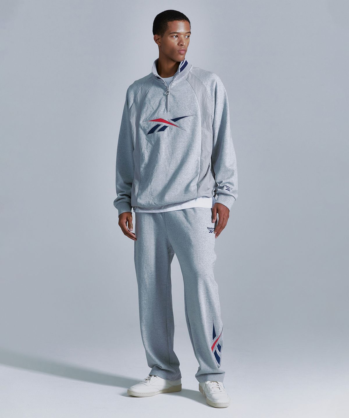리복(REEBOK) 뉴벡터 하이브리드 하프 집업 - 그레이