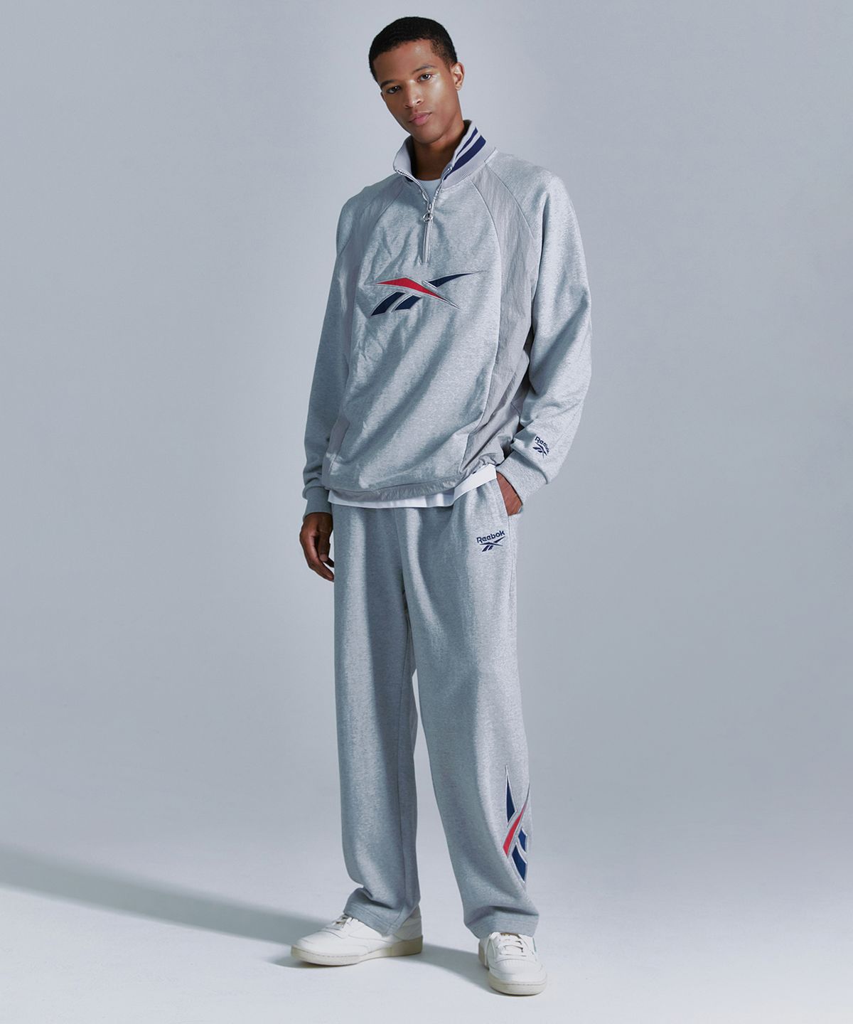 리복(REEBOK) 뉴벡터 하이브리드 하프 집업 - 그레이