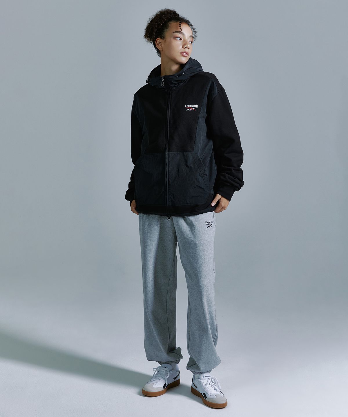리복(REEBOK) 뉴벡터 하이브리드 후드집업 - 블랙