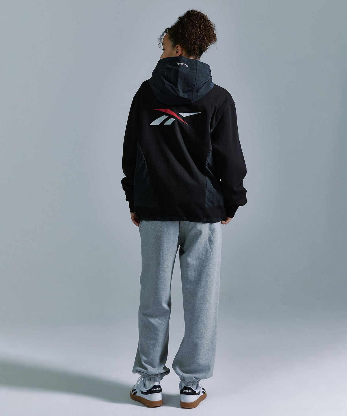 리복(REEBOK) 뉴벡터 하이브리드 후드집업 - 블랙