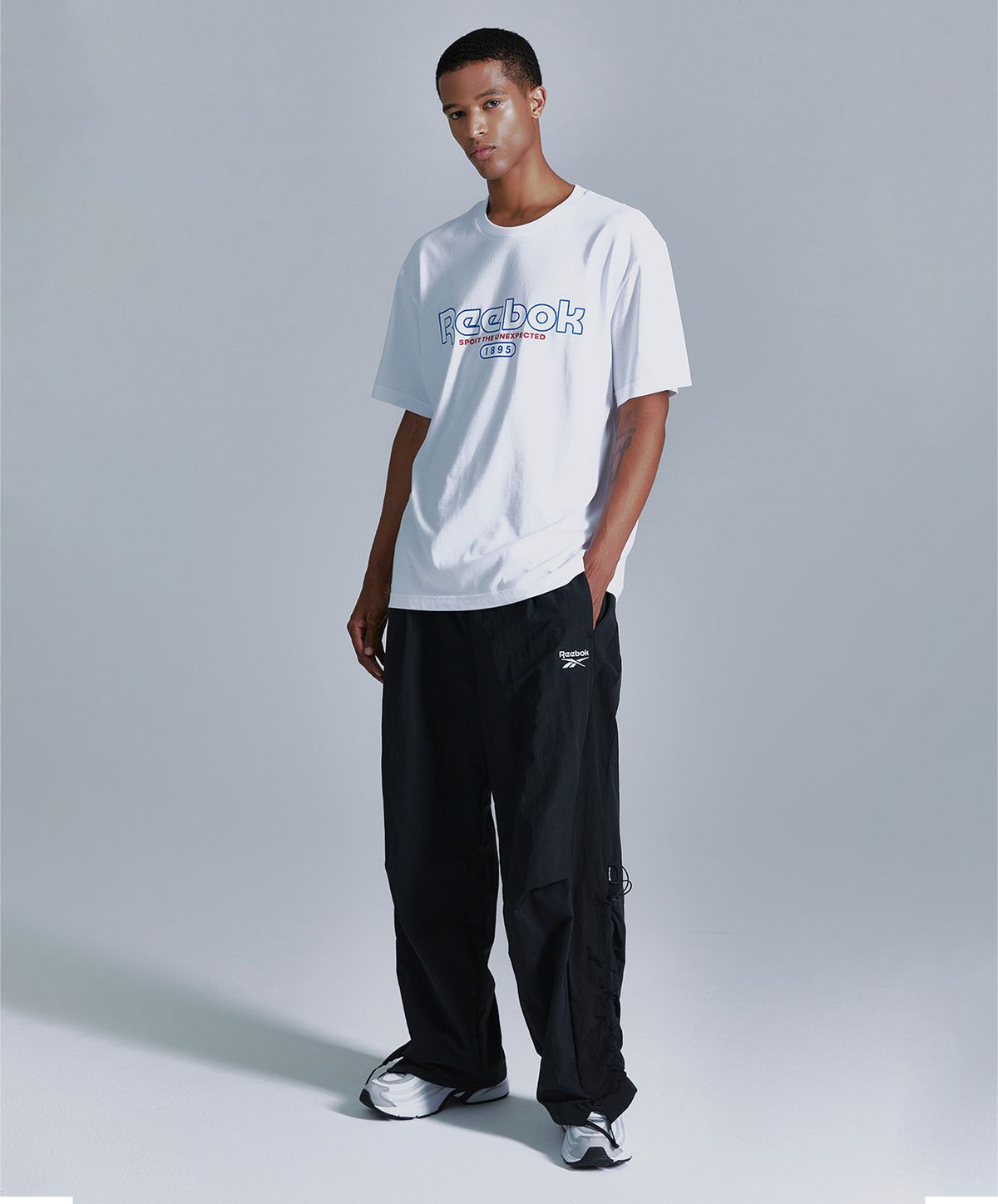 리복(REEBOK) 라이벌 립스탑 와이드 팬츠 - 블랙