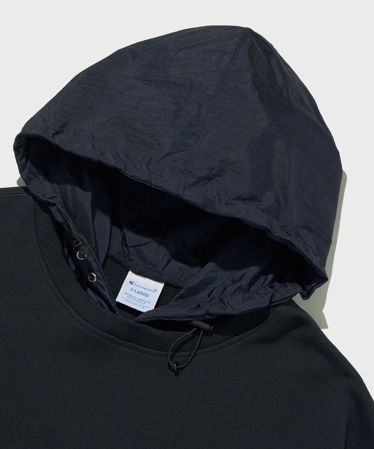 챔피온(CHAMPION) 우븐 믹스 스트링 후드 티셔츠 Normal Navy