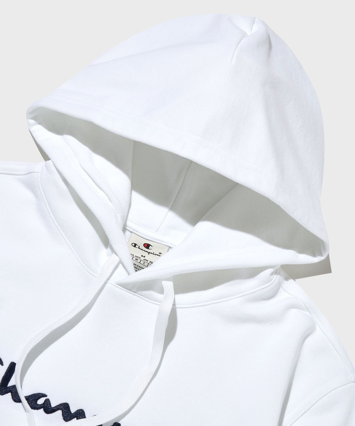 챔피온(CHAMPION) 빅 스크립트 로고 후드 티셔츠 White