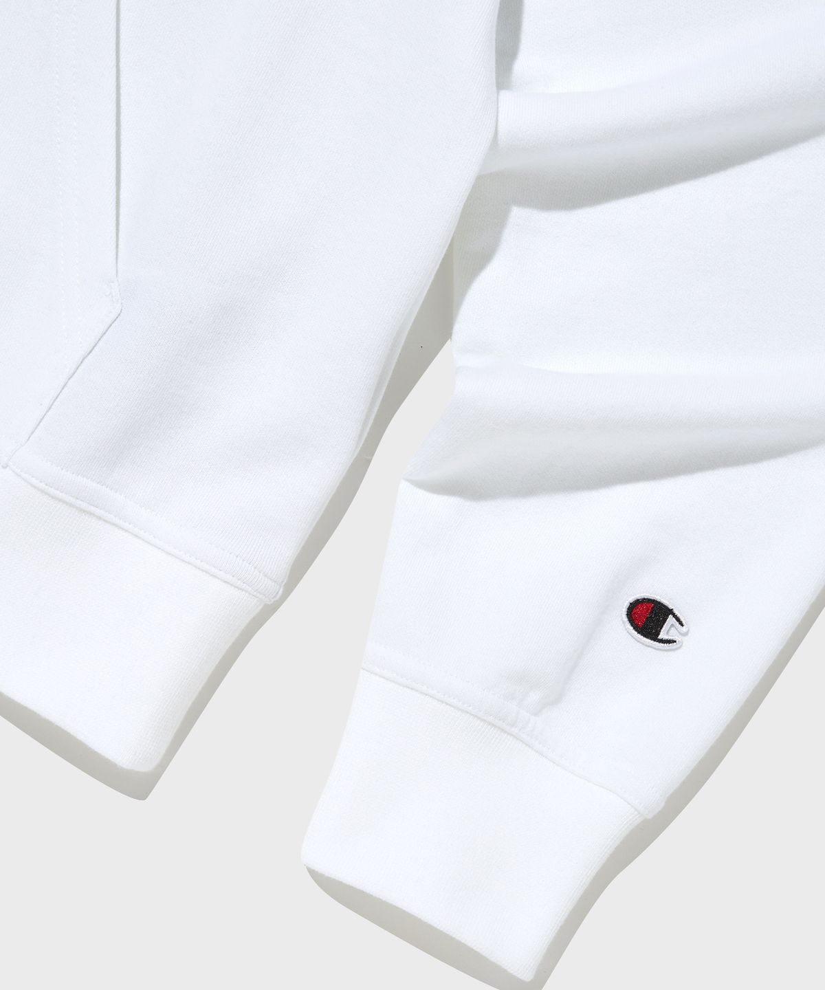 챔피온(CHAMPION) 빅 스크립트 로고 후드 티셔츠 White