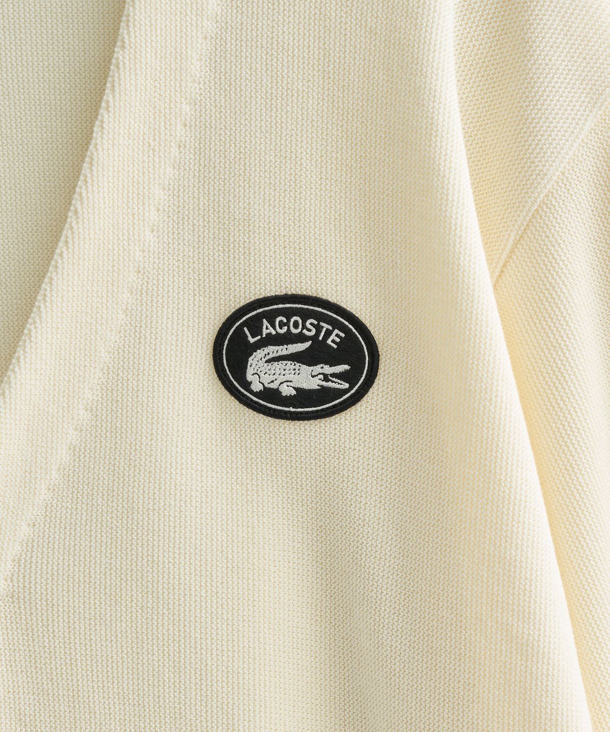 라코스테(LACOSTE) 링스링스 가디건 (아이보리)