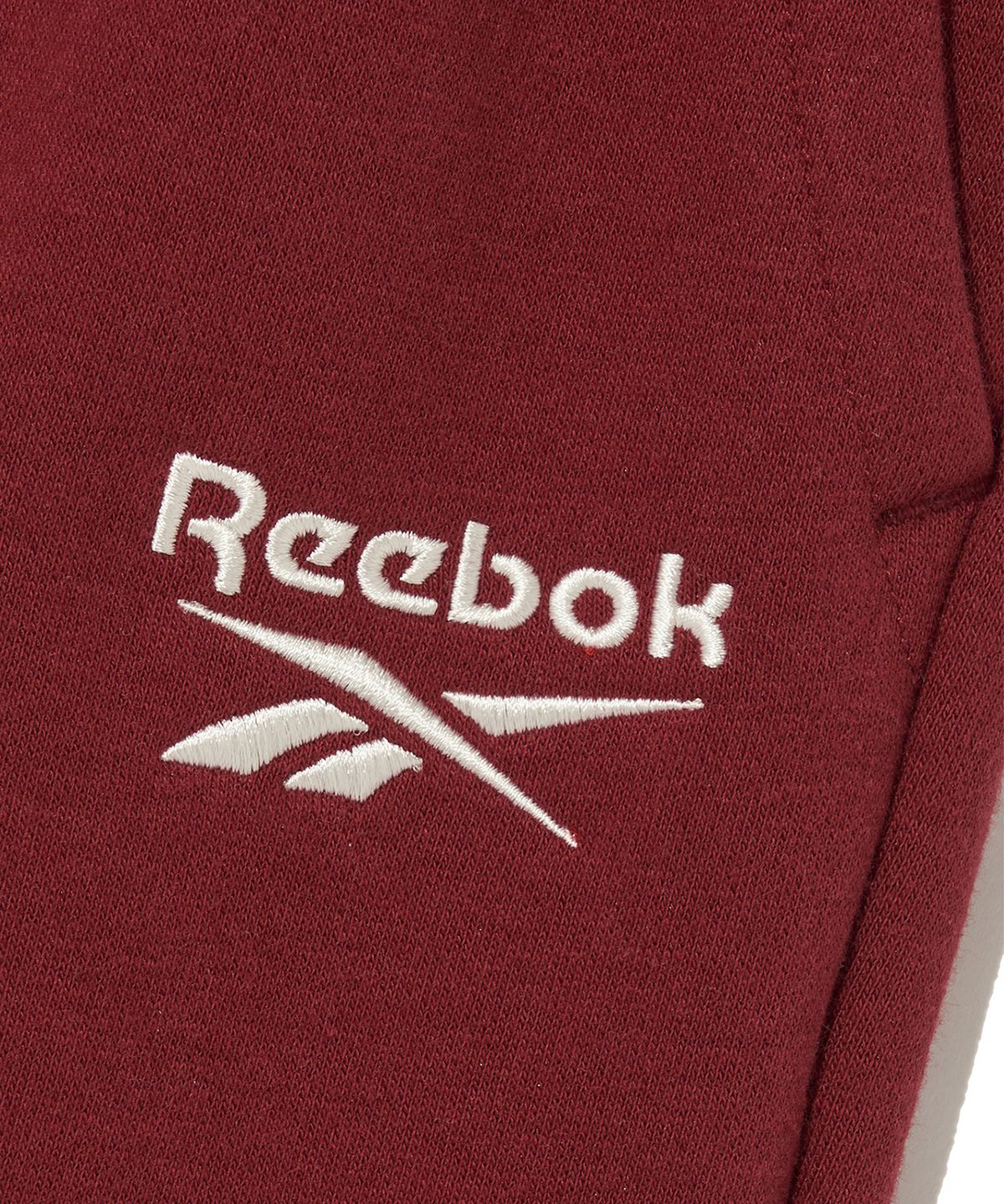 리복(REEBOK) 2WAY 기모 스웨트 팬츠 - 레드