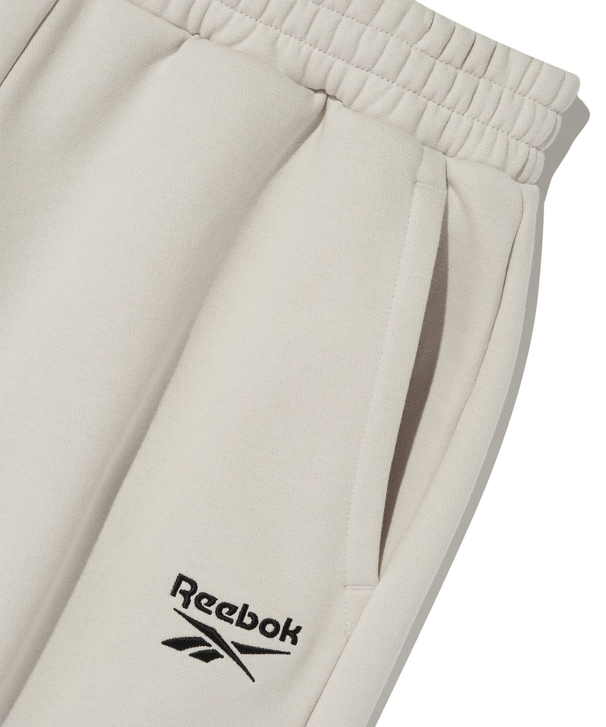리복(REEBOK) 2WAY 기모 스웨트 팬츠 - 베이지
