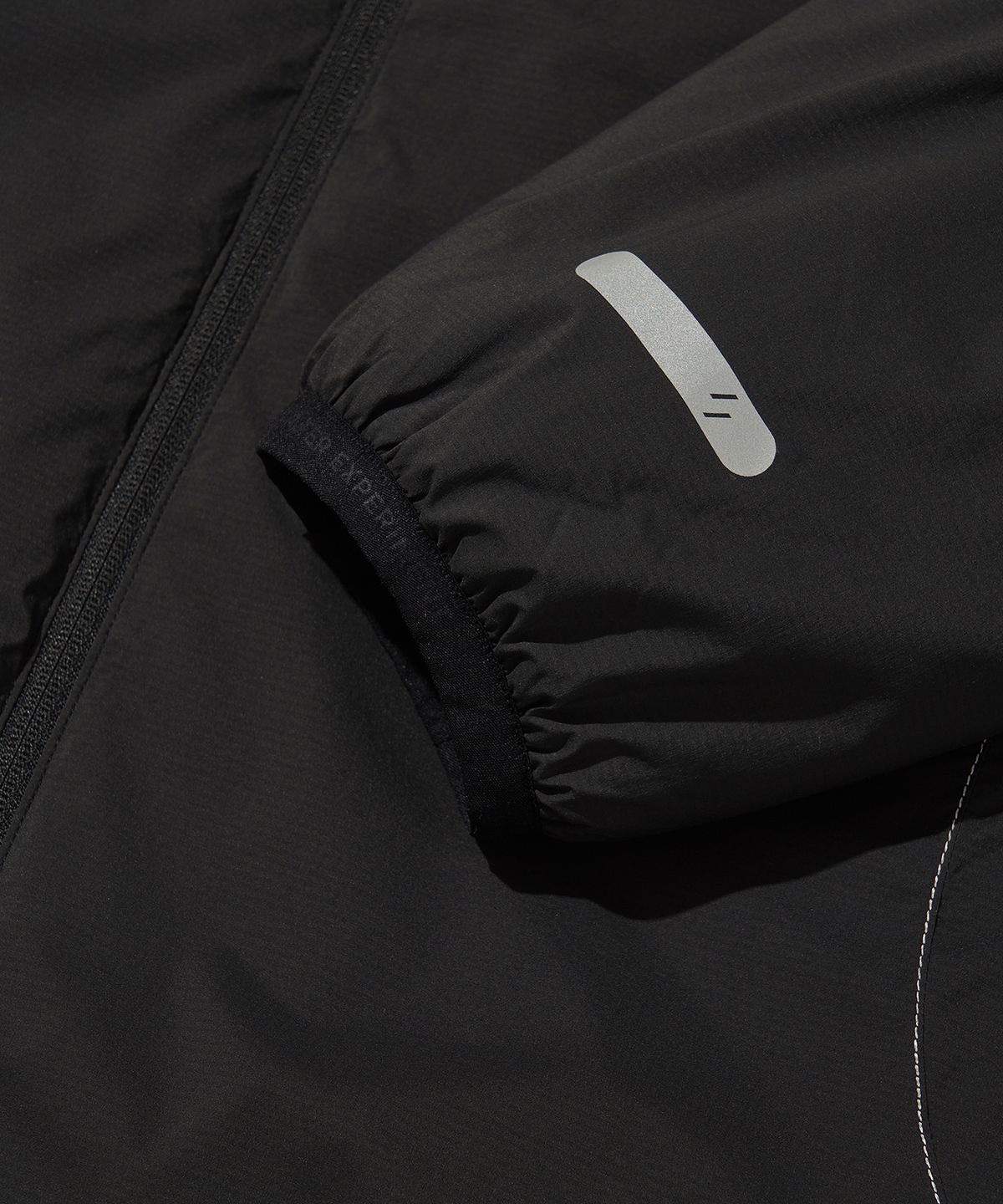 웰터 익스페리먼트(WELTER EXPERIMENT) REFLECTIVE STITCH PRIMALOFT INSULATION JACKET_BLACK_WOL085
