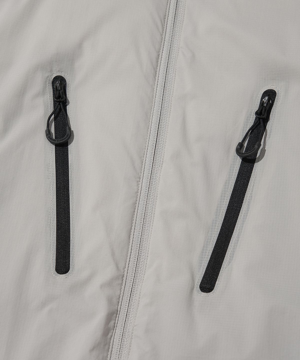 웰터 익스페리먼트(WELTER EXPERIMENT) REFLECTIVE STITCH PRIMALOFT INSULATION JACKET_LIGHT GRAY_WOL086