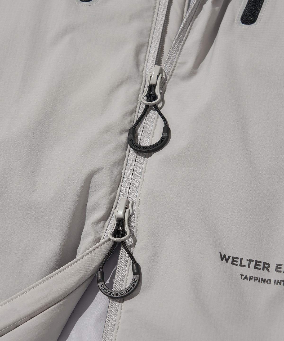 웰터 익스페리먼트(WELTER EXPERIMENT) REFLECTIVE STITCH PRIMALOFT INSULATION JACKET_LIGHT GRAY_WOL086