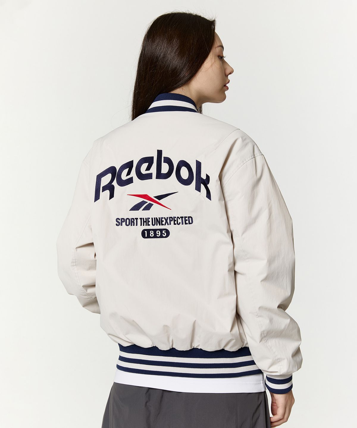 리복(REEBOK) 뉴베이직 바시티 자켓 - 베이지
