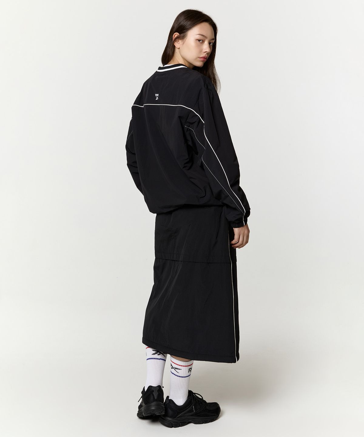 리복(REEBOK) 파라슈트 패딩 스커트 (W) - 블랙