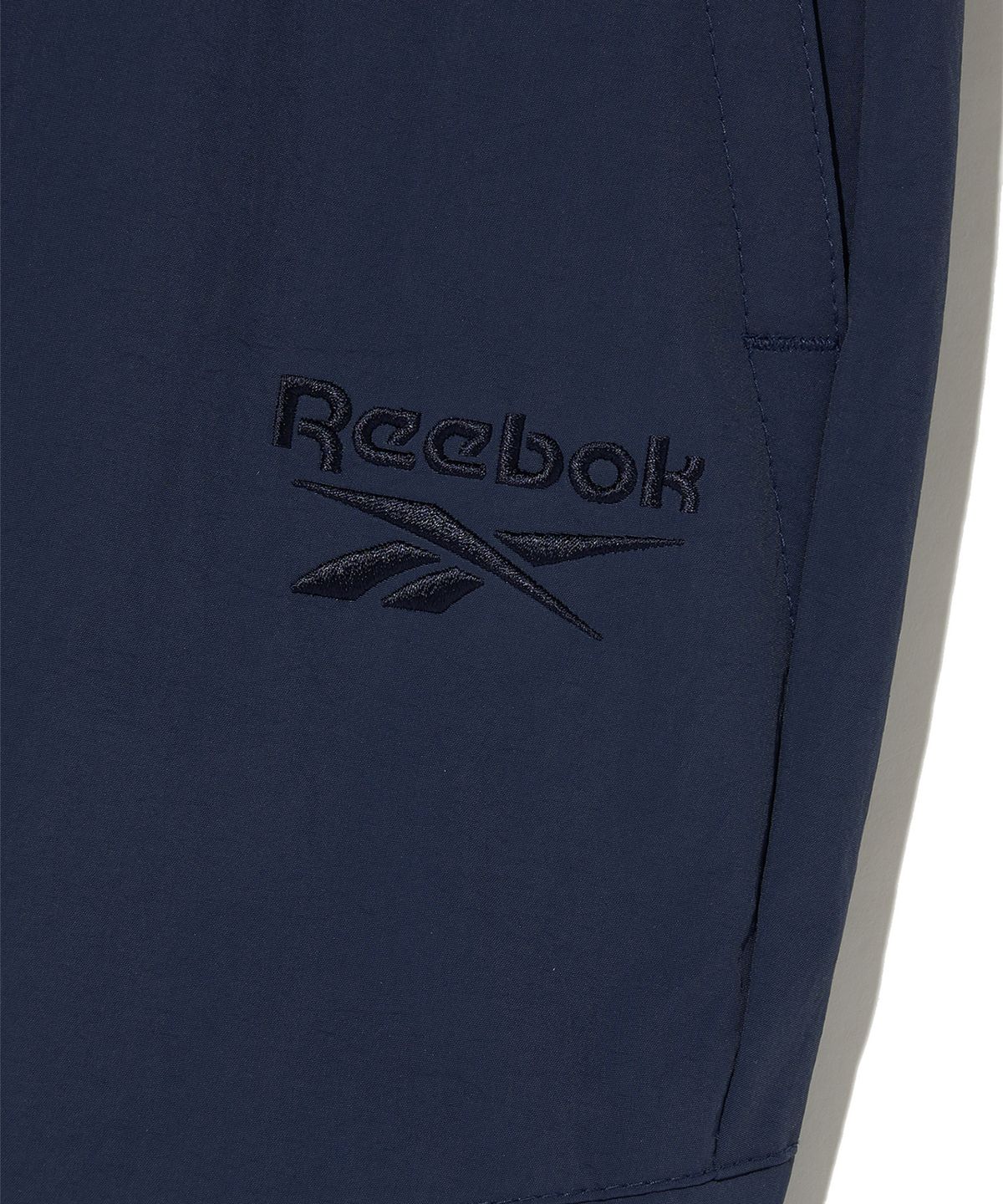 리복(REEBOK) 우븐 웜 카고 팬츠 - 네이비