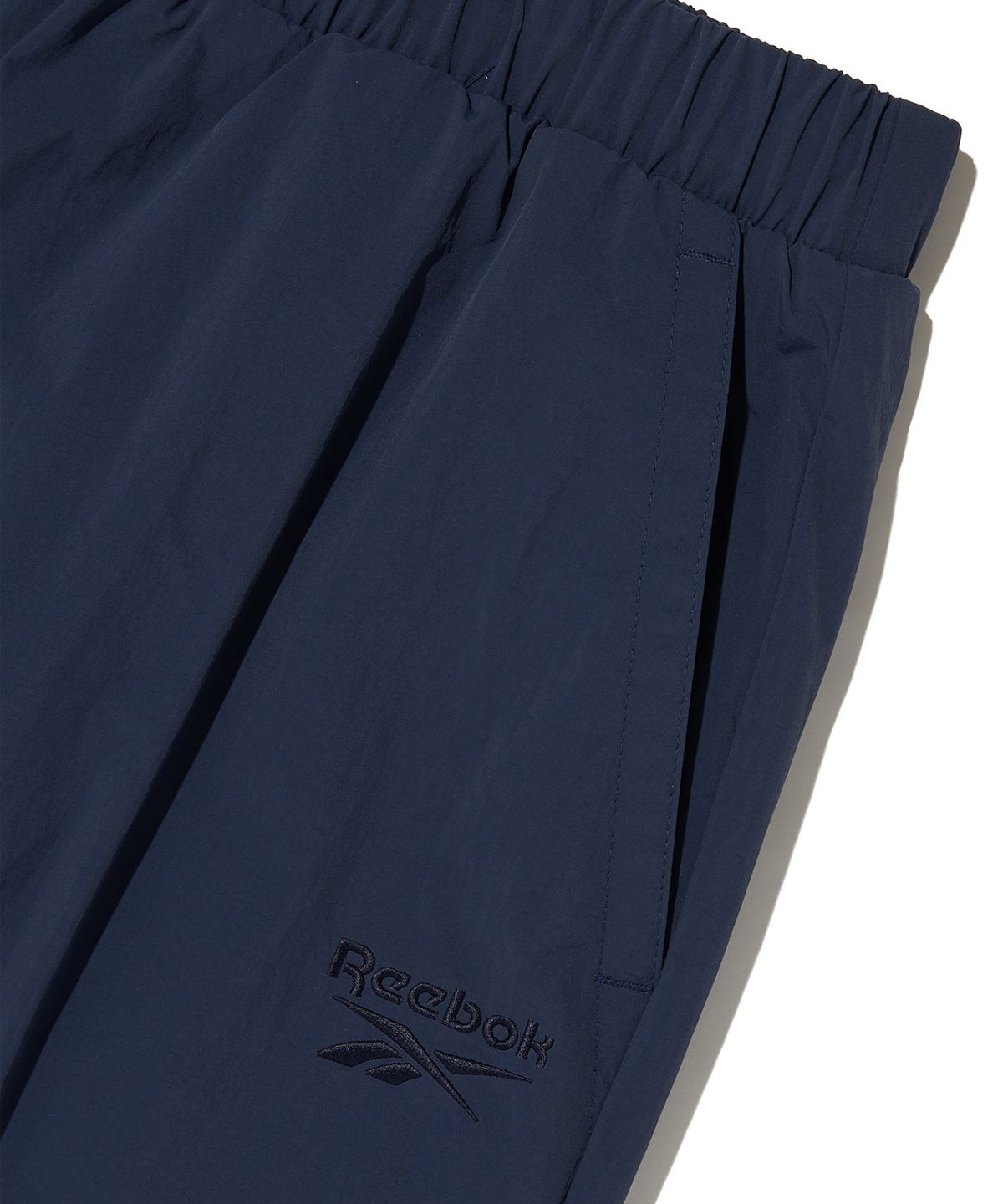 리복(REEBOK) 우븐 웜 카고 팬츠 - 네이비