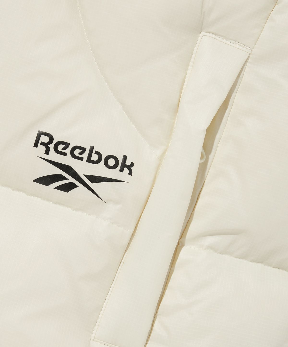 리복(REEBOK) 펌프 패리스 다운 베스트 - 아이보리