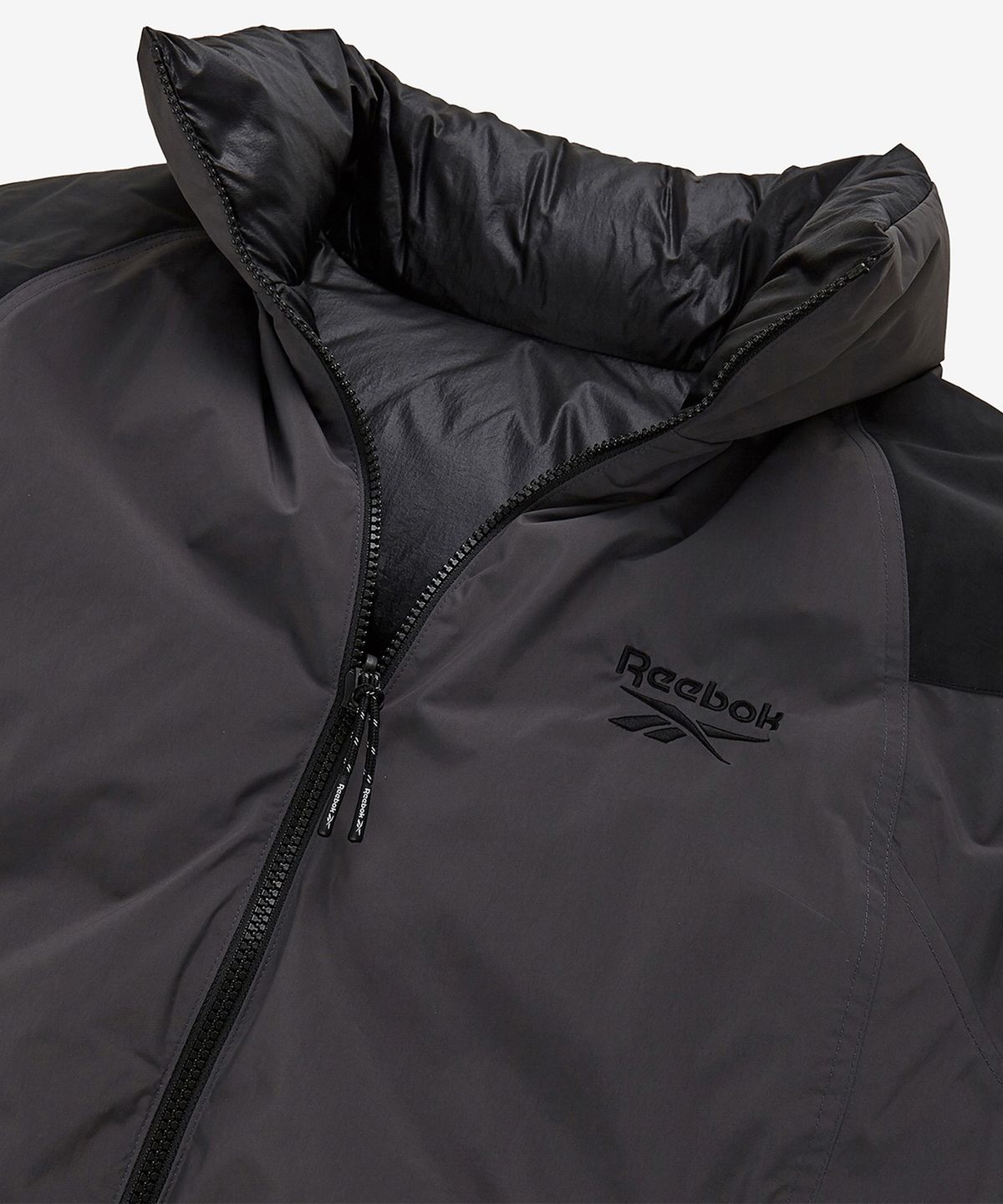 리복(REEBOK) 벡터 리버시블 다운 자켓 - 차콜