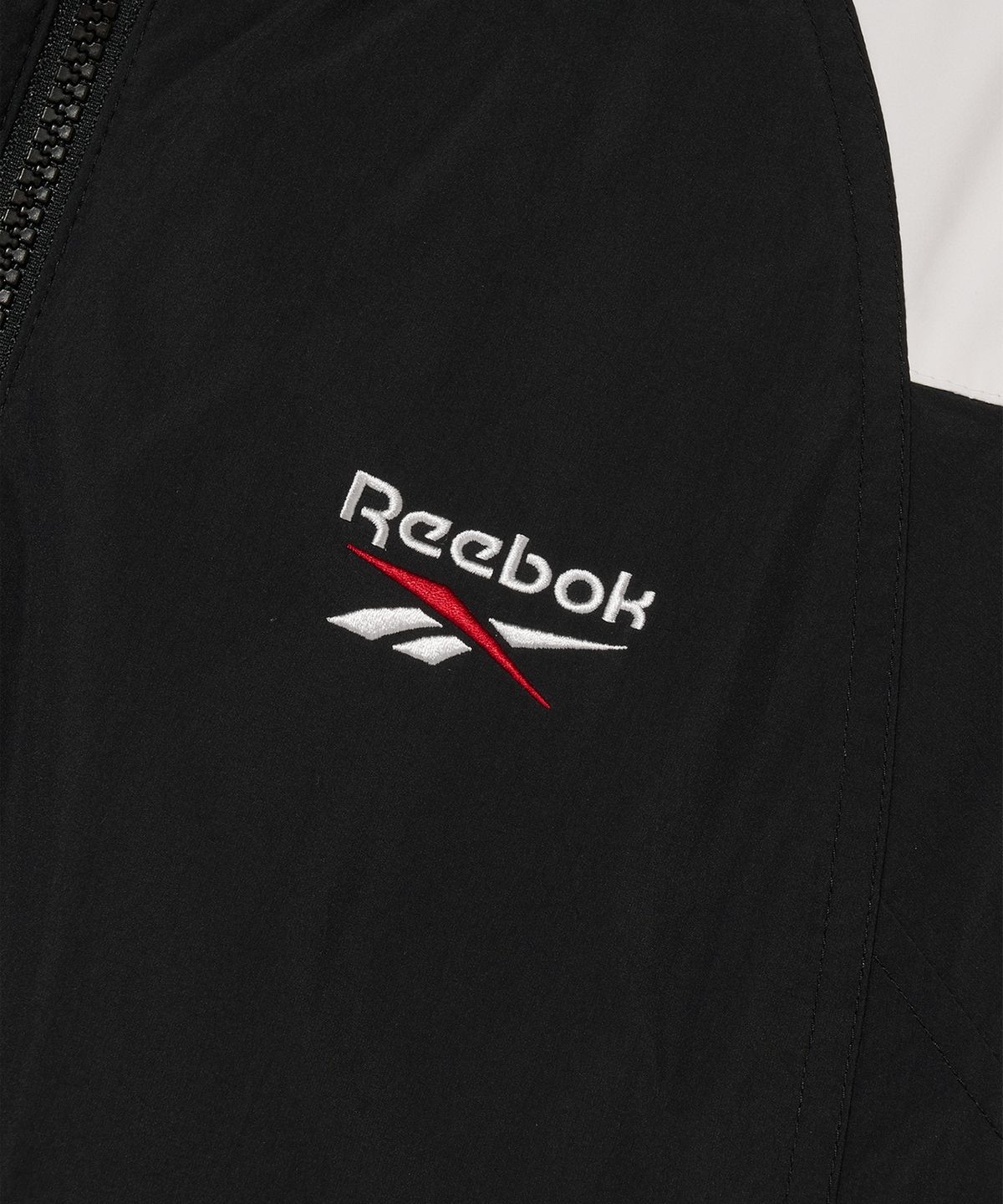 리복(REEBOK) 벡터 리버시블 크롭 다운 자켓 (W) - 블랙