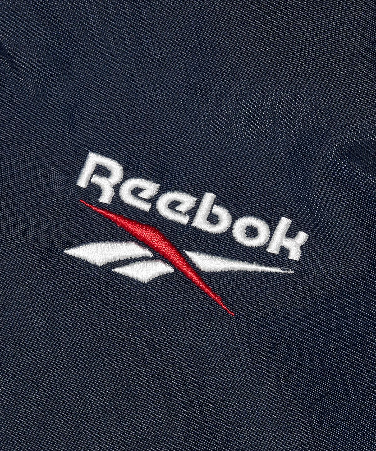 리복(REEBOK) 벡터 패널드 벤치 코트 - 네이비