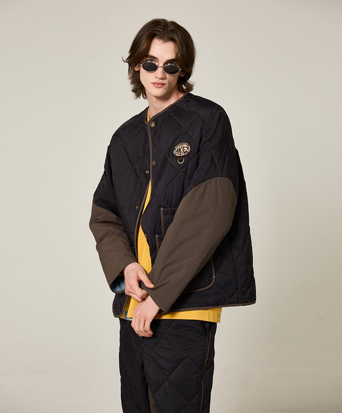 누크피터(NUUKFITTER) AERO LOGO PATCHED PADDING JUMPER [BLACK]