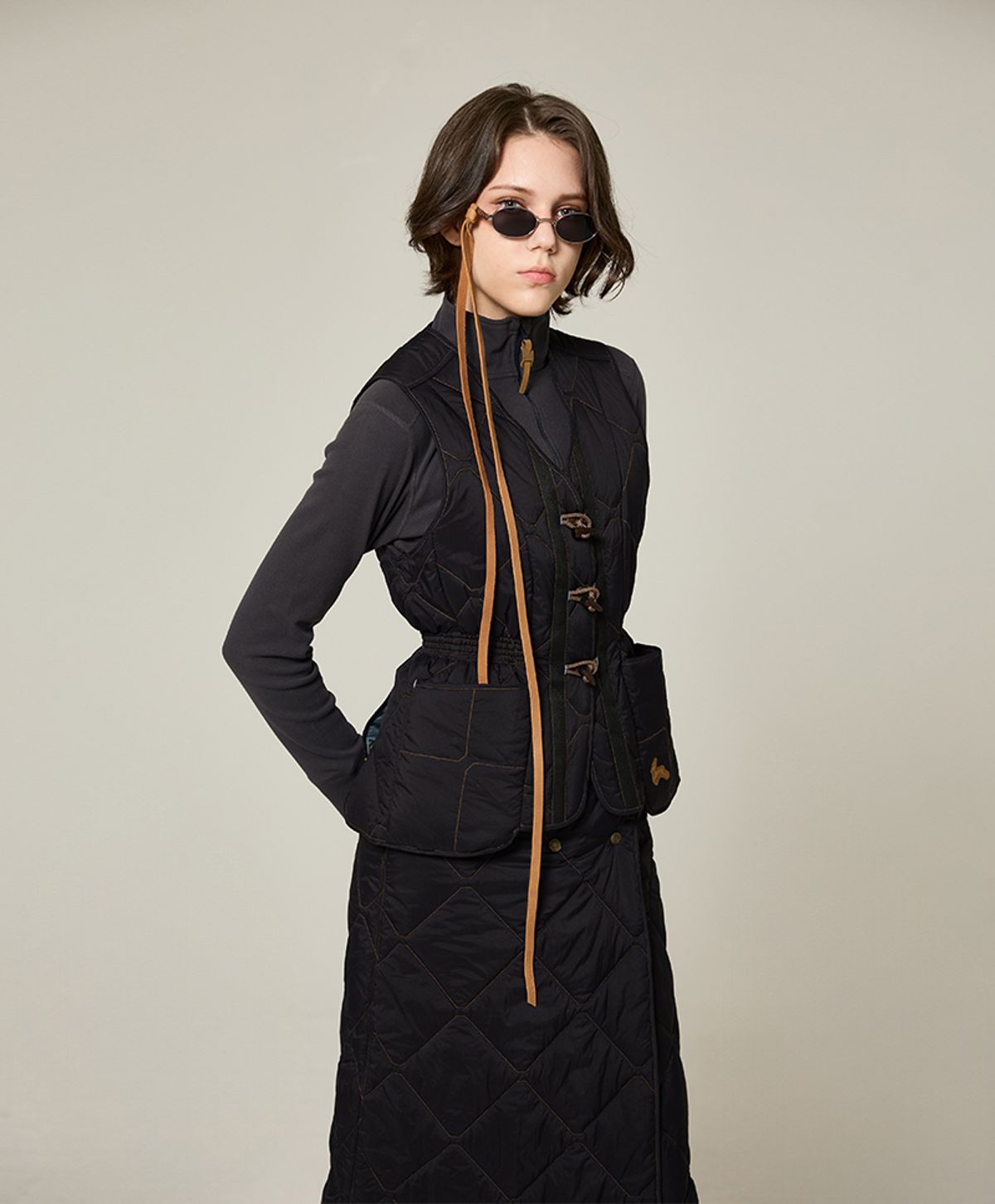 누크피터(NUUKFITTER) AERO TOGGLE PADDING VEST_WOMEN [BLACK]
