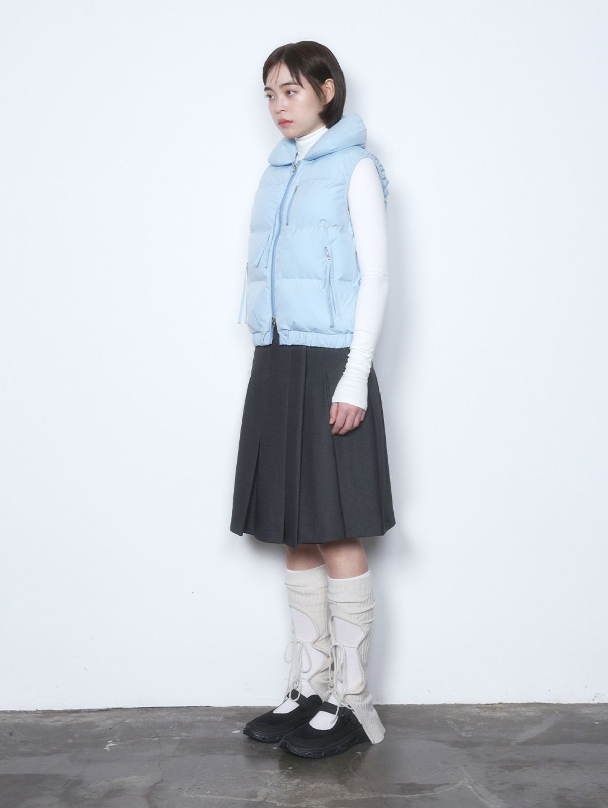 뚜오미오(TUOMIO) STRAP PUFFER VEST [BABY BLUE]
