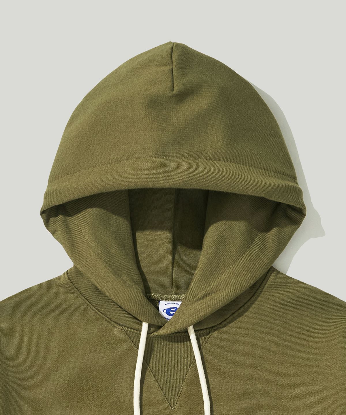 이스트코(EASTCO) OVAL LOGO HW HOODIE OLIVE