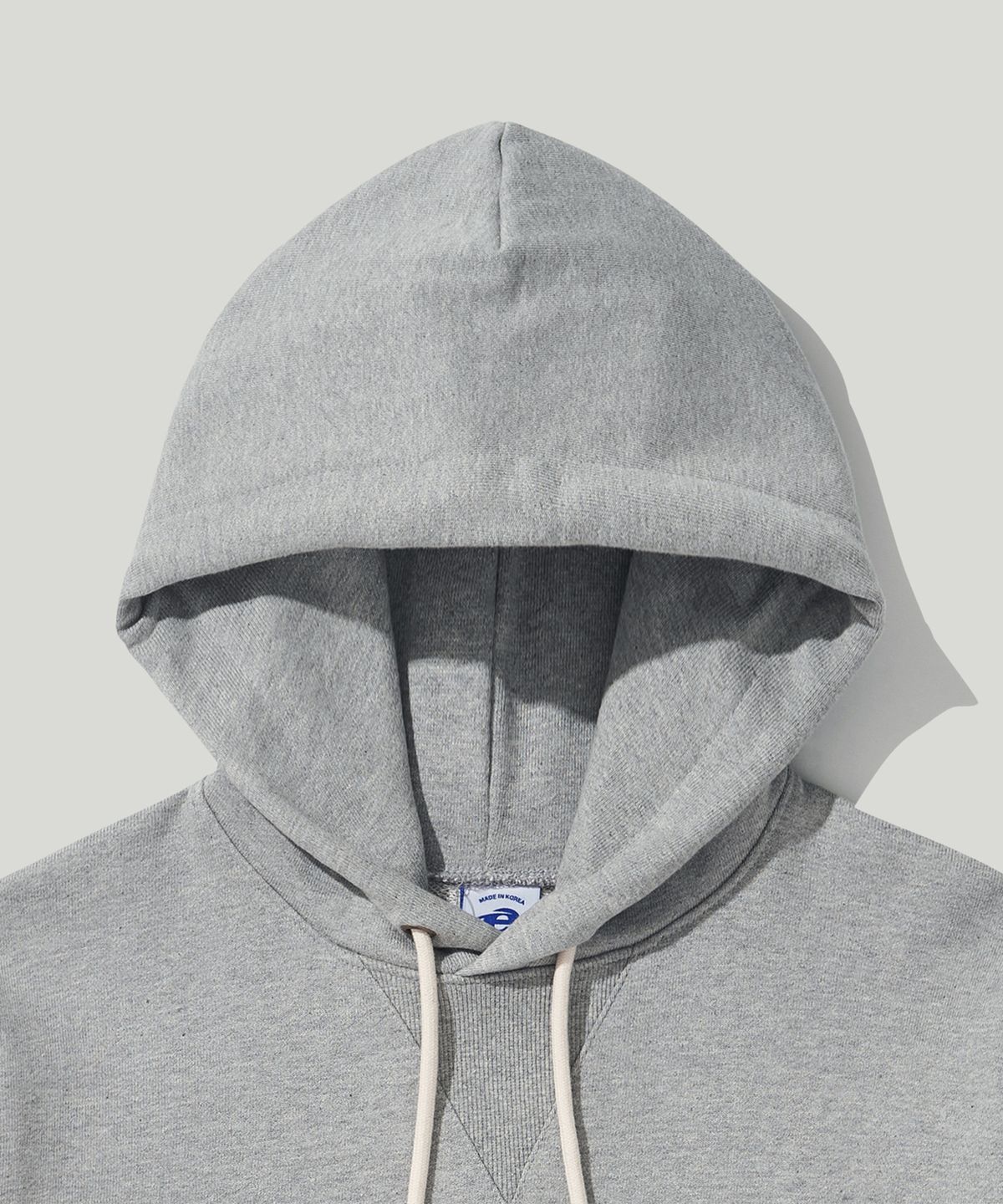 이스트코(EASTCO) OVAL LOGO HW HOODIE HEATHER GREY