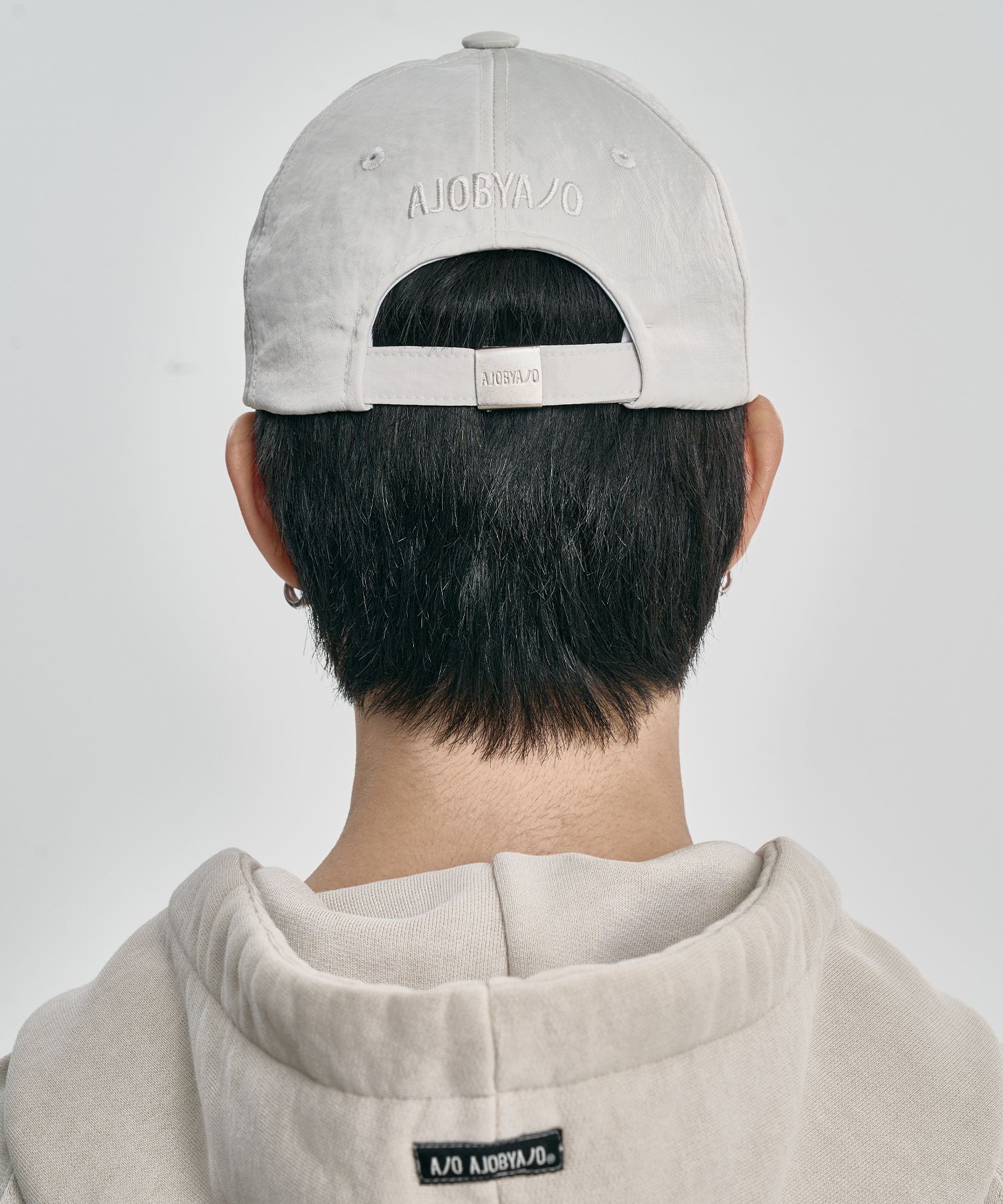 MUSINSA | AJOBYAJO Cross Symbol Nylon Cap [IVORY]