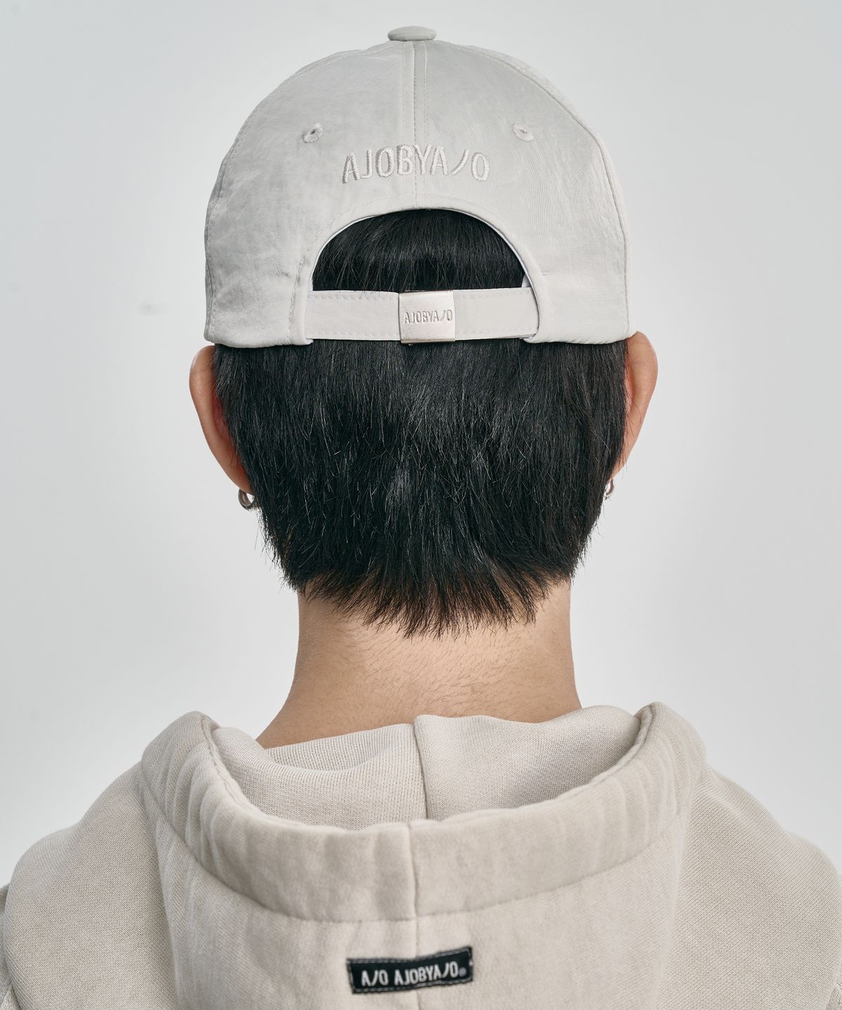 아조바이아조(AJOBYAJO) Cross Symbol Nylon Cap [IVORY]