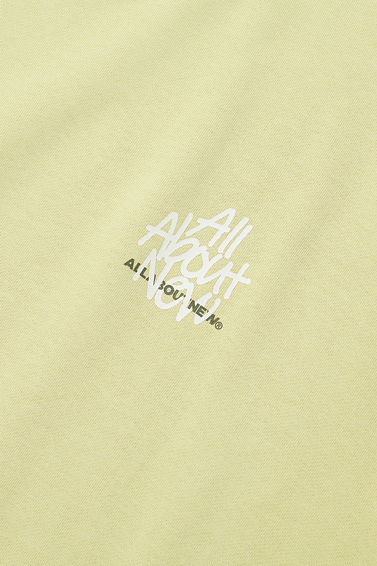 올어바웃뉴(ALL ABOUT NEW) 흘림체 로고 맨투맨 옐로우 ANZ1TM31GYE