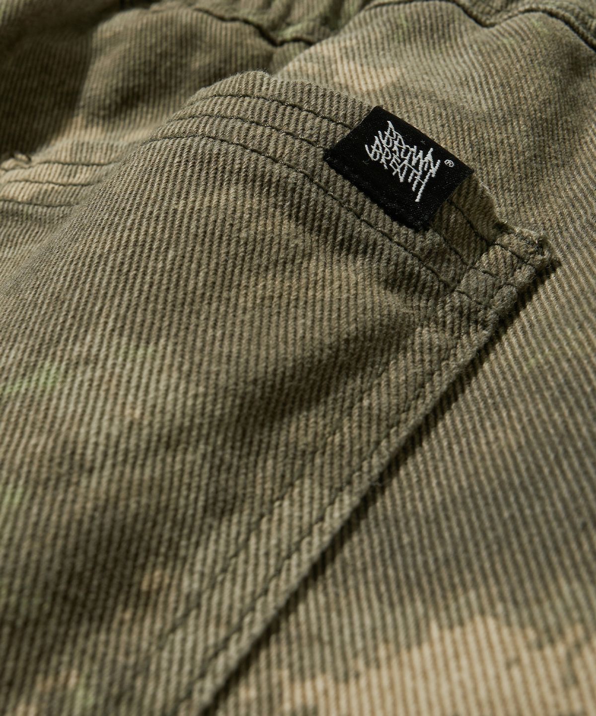 브라운브레스(BROWNBREATH) TAG GERMAN CAMO BANDING PANTS - BROWN