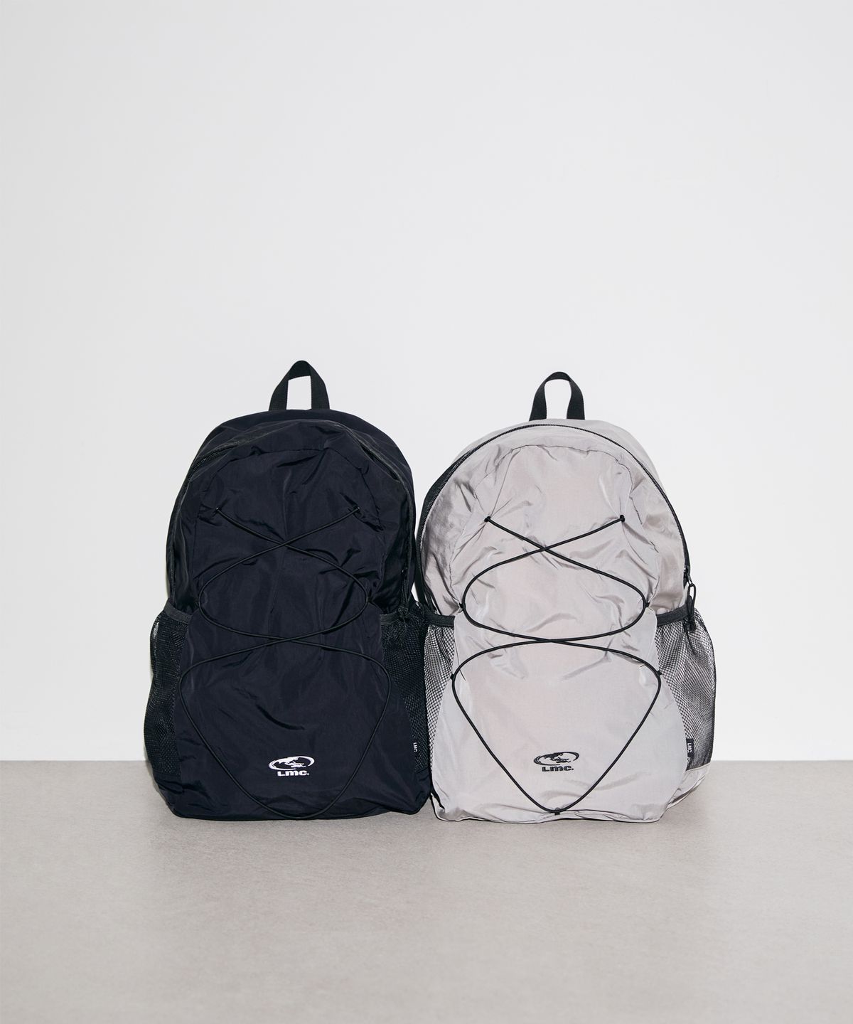 엘엠씨(LMC) OVAL GLOBE STRING BACKPACK gray