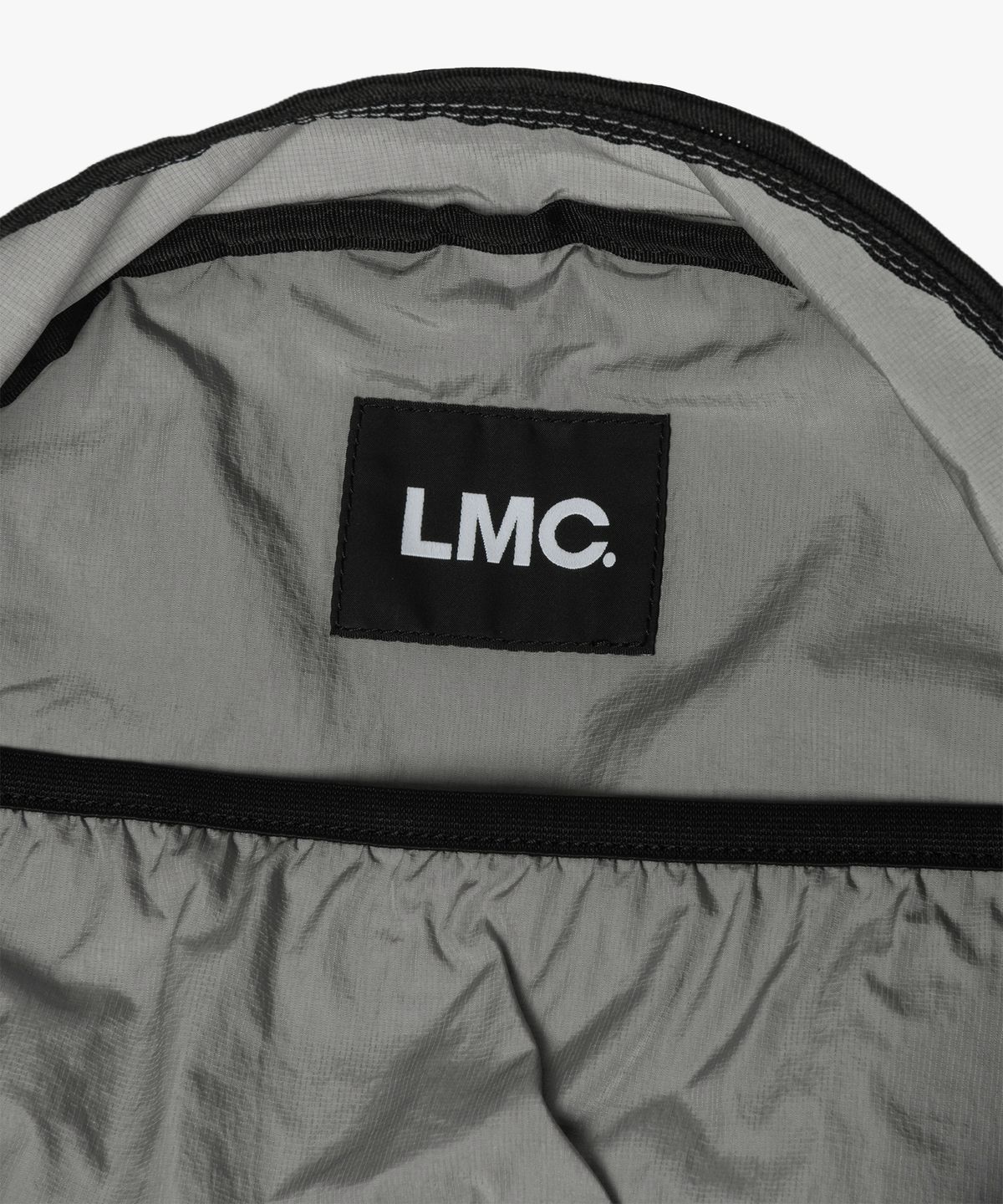 엘엠씨(LMC) OVAL GLOBE STRING BACKPACK gray